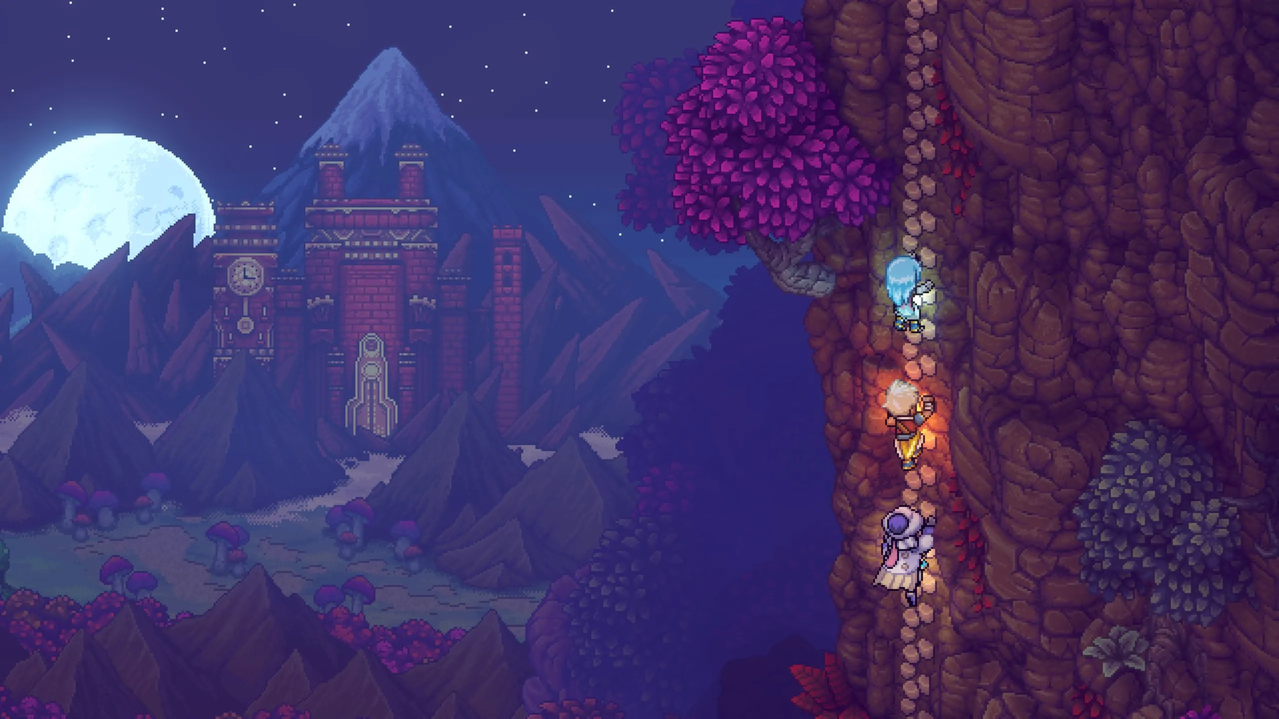 Three party members scale a sheer, root-covered cliff face on the right side of the screen, lit by a warm glow. In the background, a full moon rises over jagged mountains and a towering red-brick temple with a clock set into its facade, all rendered in rich pixel art beneath a starry night sky dotted with pink-leafed trees and mushrooms.