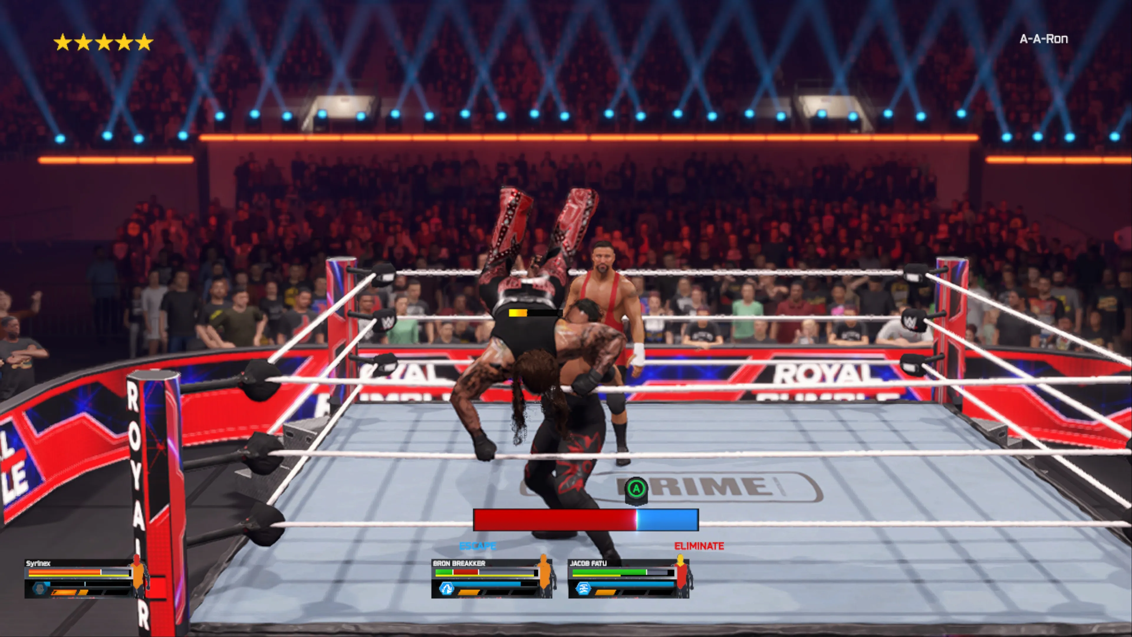 A wrestler in black attire performs getting eliminated from the ring during a Royal Rumble match, with other wrestlers standing in the background and an ‘ELIMINATE’ prompt displayed on screen in WWE 2K25