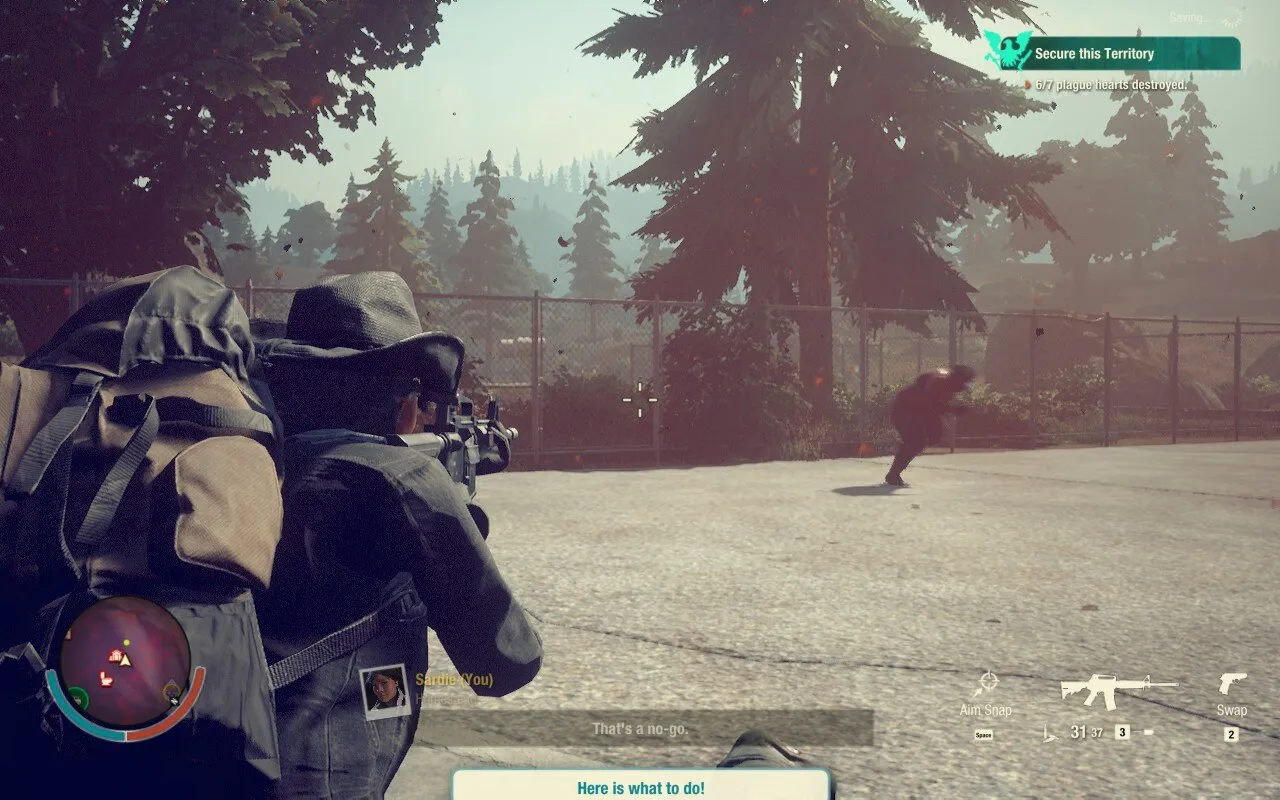 A character in a hat and backpack aims a rifle at an approaching zombie in an outdoor setting surrounded by trees and a chain-link fence. The scene shows a heads-up display (HUD) showing a mini-map, health bar, and weapon information. A notification in the upper right corner reads Secure this Territory with progress indicated as 6/7 plague hearts destroyed. The atmosphere is tense, with the character ready to engage in combat.